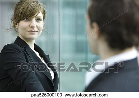 Businesswoman and businessman meet and shake hands View Large Photo Image Stock Image - Businesswoman and businessman meet and shake hands. Fotosearch
