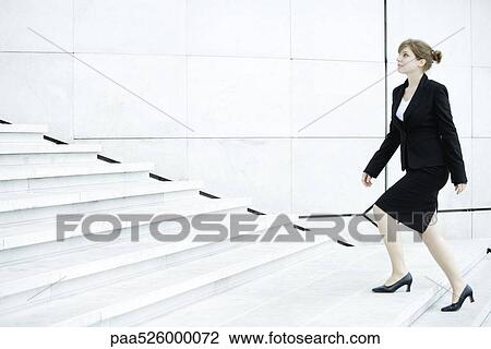 Businesswoman ascending steps View Large Photo Image Stock Image - Businesswoman ascending steps. Fotosearch