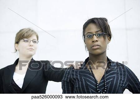 Businesswoman tapping associate on shoulder View Large Photo Image Stock Image - Businesswoman tapping associate on shoulder. Fotosearch