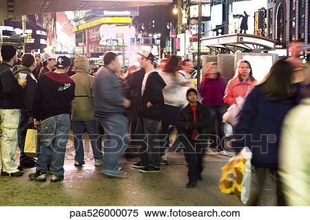 Crowd scene on sidewalk near bus stop on Broadway in New York City looking north at Times Square View Large Photo Image Stock Photography - Crowd scene on sidewalk near bus stop on Broadway in New York City looking north at Times Square. Fotosearch