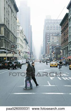 Pedestrians crossing street in crosswalk at W 19th Street and 6th Avenue Chelsea, New York, facing NE View Large Photo Image Stock Image - Pedestrians crossing street in crosswalk at W 19th Street and 6th Avenue Chelsea, New York, facing NE. Fotosearch