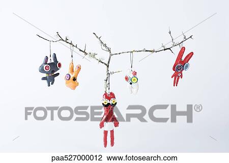 Cell phone charms hanging from branches View Large Photo Image Stock Image - Cell phone charms hanging from branches. Fotosearch