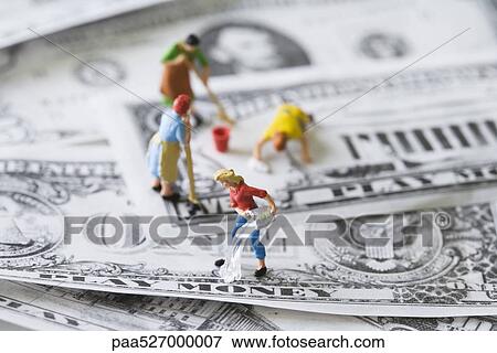 Miniature cleaning ladies washing play money View Large Photo Image Stock Photo - Miniature cleaning ladies washing play money. Fotosearch