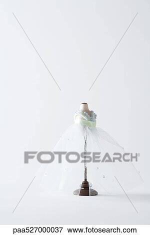 Miniature wedding dress on dressmaker's form View Large Photo Image Stock Photo - Miniature wedding dress on dressmaker's form. Fotosearch