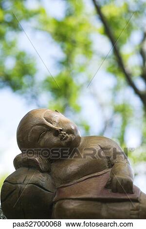 Sleeping Buddha statue, close-up View Large Photo Image Stock Photo - Sleeping Buddha statue, close-up. Fotosearch