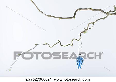 Toy hanging from tree branch View Large Photo Image Stock Image - Toy hanging from tree branch. Fotosearch