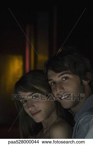 Couple posing close together, smiling at camera, portrait View Large Photo Image Picture - Couple posing close together, smiling at camera, portrait. Fotosearch