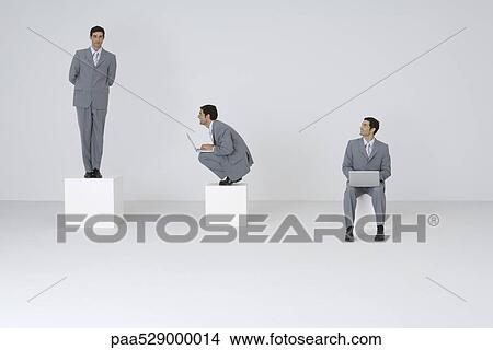 Picture - Businessman admiring self, digital composite. Fotosearch