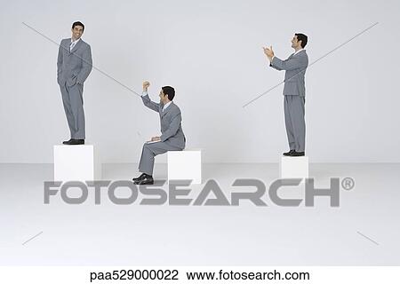 Businessman being congratulated by clones of self, digital composite View Large Photo Image Stock Image - Businessman being congratulated by clones of self, digital composite. Fotosearch