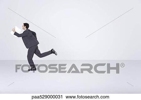 Businessman running with document View Large Photo Image Stock Image - Businessman running with document. Fotosearch