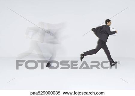 Businessman running with document View Large Photo Image Stock Photography - Businessman running with document. Fotosearch