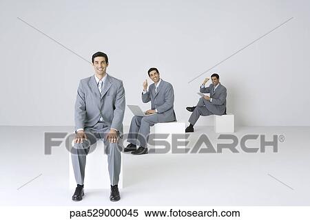 Successful businessman encouraging himself, digital composite View Large Photo Image Stock Photography - Successful businessman encouraging himself, digital composite. Fotosearch