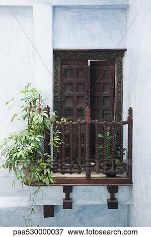 Stone Town, Zanzibar, Tanzania, ornate door slightly ajar, leading onto small balcony View Large Photo Image Stock Photo - Stone Town, Zanzibar, Tanzania, ornate door slightly ajar, leading onto small balcony. Fotosearch