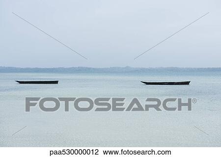 Tanzania, Zanzibar, dugout canoes View Large Photo Image Stock Image - Tanzania, Zanzibar, dugout canoes. Fotosearch