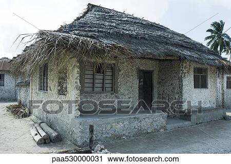 Tanzania, Zanzibar, house made of stone with thatched roof View Large Photo Image Stock Image - Tanzania, Zanzibar, house made of stone with thatched roof. Fotosearch