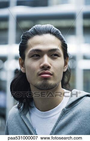 Male with long hair and goatee looking away, portrait View Large Photo Image Stock Photo - Male with long hair and goatee looking away, portrait. Fotosearch