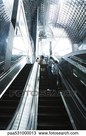 People going up escalator, rear view View Large Photo Image Stock Image - People going up escalator, rear view. Fotosearch