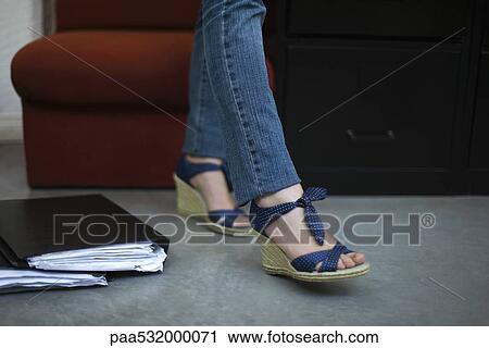 Woman wearing wedge espadrilles, low section View Large Photo Image Stock Image - Woman wearing wedge espadrilles, low section. Fotosearch
