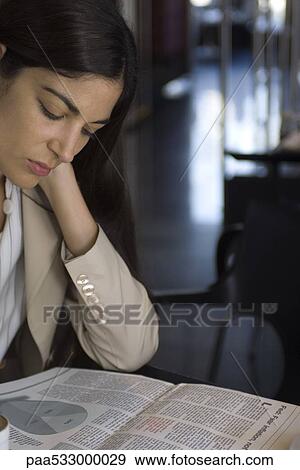 Woman reading newspaper View Large Photo Image Stock Photo - Woman reading newspaper. Fotosearch