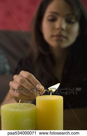Young woman lighting candles, focus on foreground View Large Photo Image Stock Image - Young woman lighting candles, focus on foreground. Fotosearch