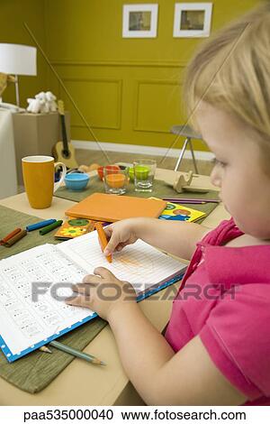 Little girl coloring at table, close-up View Large Photo Image Stock Image - Little girl coloring at table, close-up. Fotosearch