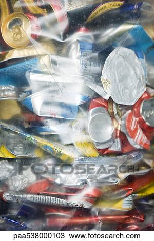 Stock Image - Aluminum cans in plastic bag, full frame. Fotosearch