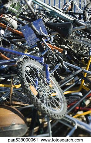 Bicycles in junk heap, close-up View Large Photo Image Stock Image - Bicycles in junk heap, close-up. Fotosearch