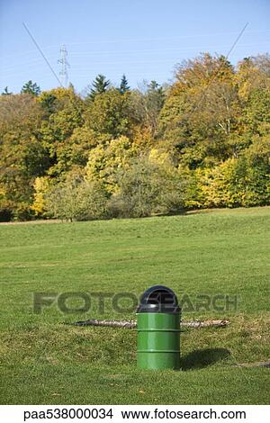 Garbage can in park View Large Photo Image Picture - Garbage can in park. Fotosearch