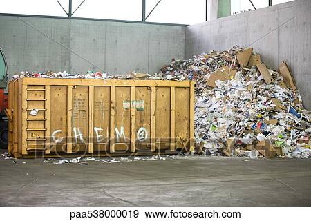 Paper and cardboard piled up beside dumpster in recycling center View Large Photo Image Stock Photo - Paper and cardboard piled up beside dumpster in recycling center. Fotosearch