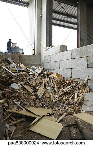 Person unloading scrap wood at recycling center View Large Photo Image Picture - Person unloading scrap wood at recycling center. Fotosearch