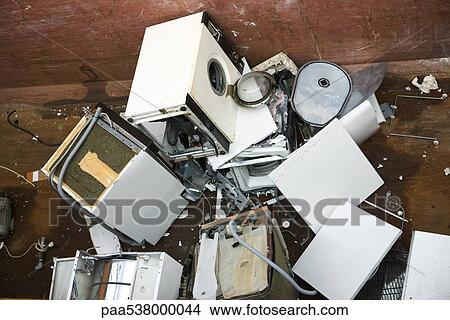 Picture - Pile of broken washing machines. Fotosearch