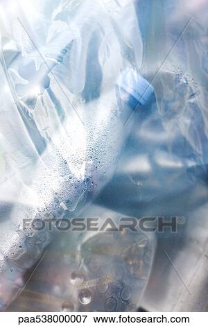 Plastic bag filled with garbage, close-up View Large Photo Image Stock Photo - Plastic bag filled with garbage, close-up. Fotosearch