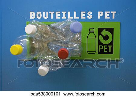 Plastic bottles spilling out of recycling bin View Large Photo Image Stock Image - Plastic bottles spilling out of recycling bin. Fotosearch