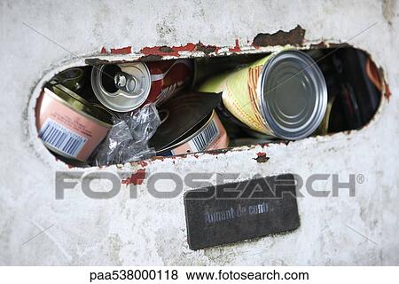 Stock Photo - Recycling bin filled with cans, extreme close-up. Fotosearch