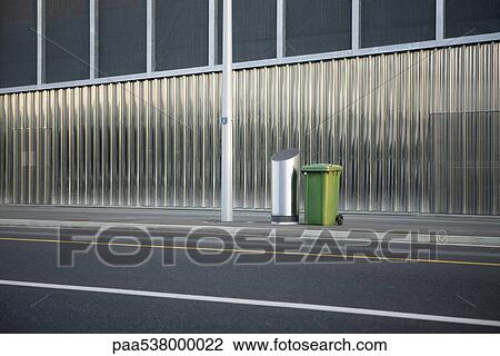 Stock Image - Trash cans on sidewalk. Fotosearch
