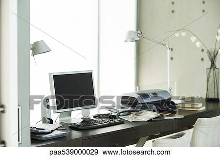Computer and printer on desk in home office View Large Photo Image Stock Photo - Computer and printer on desk in home office. Fotosearch