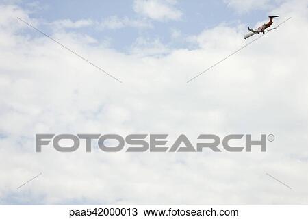 Commercial airplane in sky View Large Photo Image Stock Image - Commercial airplane in sky. Fotosearch