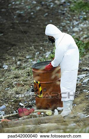 Person in protective suit carrying barrel of hazardous waste View Large Photo Image Stock Image - Person in protective suit carrying barrel of hazardous waste. Fotosearch