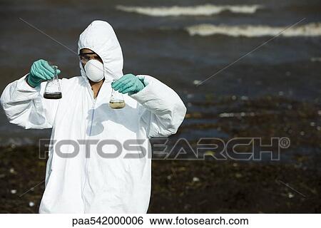 Person in protective suit testing polluted water View Large Photo Image Stock Photograph - Person in protective suit testing polluted water. Fotosearch