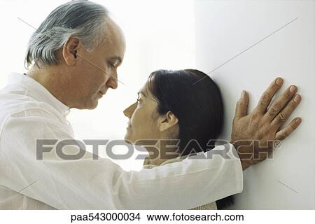 Mature couple, husband looking at wife with affection View Large Photo Image Picture - Mature couple, husband looking at wife with affection. Fotosearch