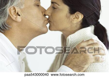 Mature couple kissing, close-up View Large Photo Image Stock Image - Mature couple kissing, close-up. Fotosearch