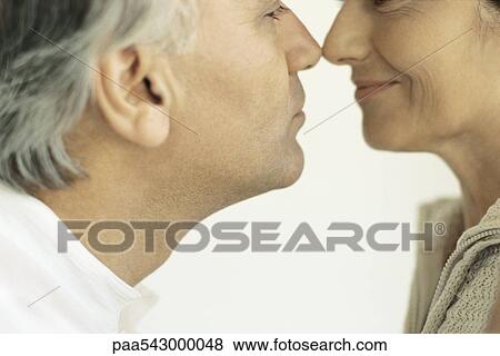 Stock Photo - Mature couple rubbing noses. Fotosearch