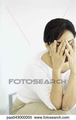 Woman covering face with hands View Large Photo Image Stock Photography - Woman covering face with hands. Fotosearch
