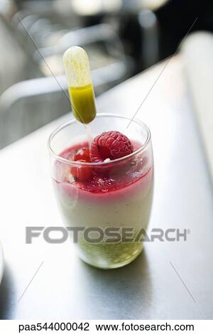 Almond mousse with pistachio coulis and berries View Large Photo Image Stock Image - Almond mousse with pistachio coulis and berries. Fotosearch