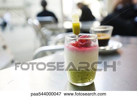 Almond mousse with pistachio coulis and berries View Large Photo Image Stock Photo - Almond mousse with pistachio coulis and berries. Fotosearch