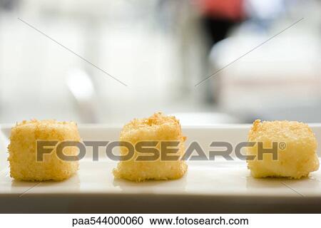 Cubes of fried cheese, close-up View Large Photo Image Stock Image - Cubes of fried cheese, close-up. Fotosearch