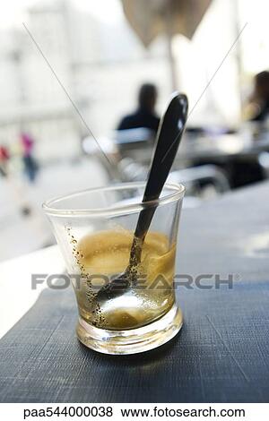 Empty espresso glass with spoon, close-up View Large Photo Image Stock Photo - Empty espresso glass with spoon, close-up. Fotosearch