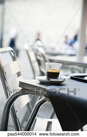 Glass of espresso set on cafe table View Large Photo Image Picture - Glass of espresso set on cafe table. Fotosearch