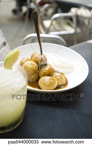 Small roasted potatoes with sauce View Large Photo Image Stock Image - Small roasted potatoes with sauce. Fotosearch