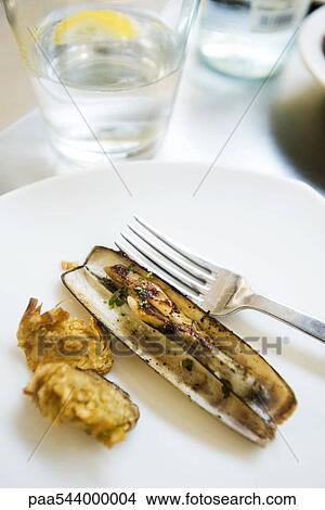 Steamed razor clam with fried artichoke heart View Large Photo Image Picture - Steamed razor clam with fried artichoke heart. Fotosearch